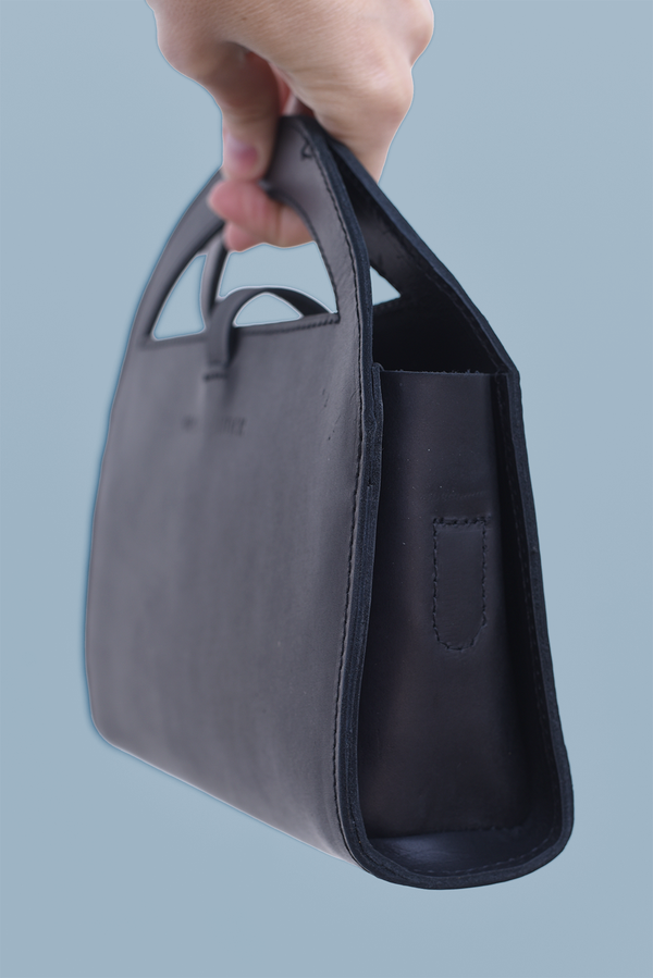 611fc05e3c4ce80992caae23_clutch-crossbody-black-side-no-strap_1785431146126.png