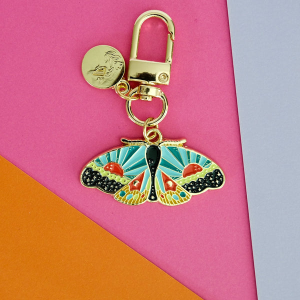 611fc05e3c4ce80992caae23_cosmicmoth-enamelkeychain-flatlay-01_1790897078433.jpg