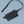 Load image into Gallery viewer, 611fc05e3c4ce80992caae23_sling-bag-black-front_1785430390044.png
