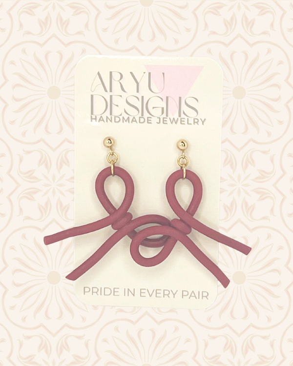 611fc05e3c4ce80992caae23_updated-bow-dangle-earrings-on-card-merlot_1790708267365.png