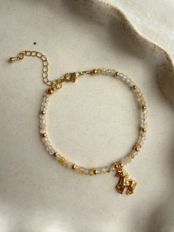611fc05e3c4ce80992caae23_year-of-the-horse-bracelet-topaz-02_1771023033068.jpg