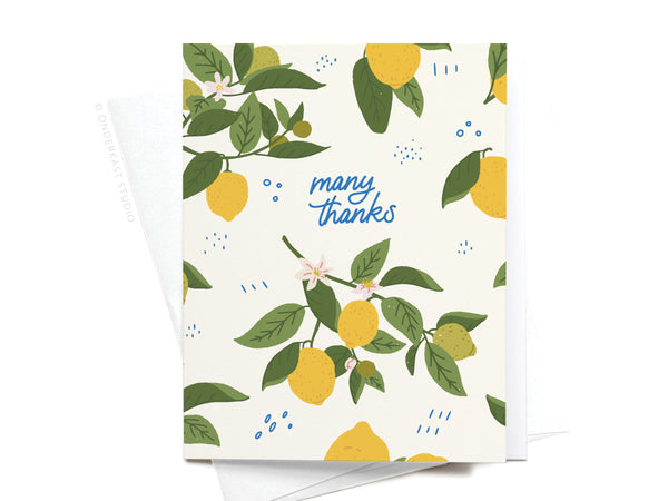 The Many Thanks Lemon Pattern Greeting Card by Onderkast Studio features illustrated lemon branches, green leaves, small flowers, and “Many thanks” in blue cursive on a white background with blue decorative marks.
